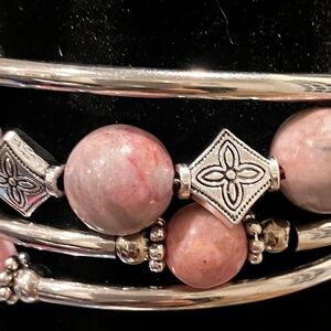 Pink beads  on 4 silver stretchable bracelets.
